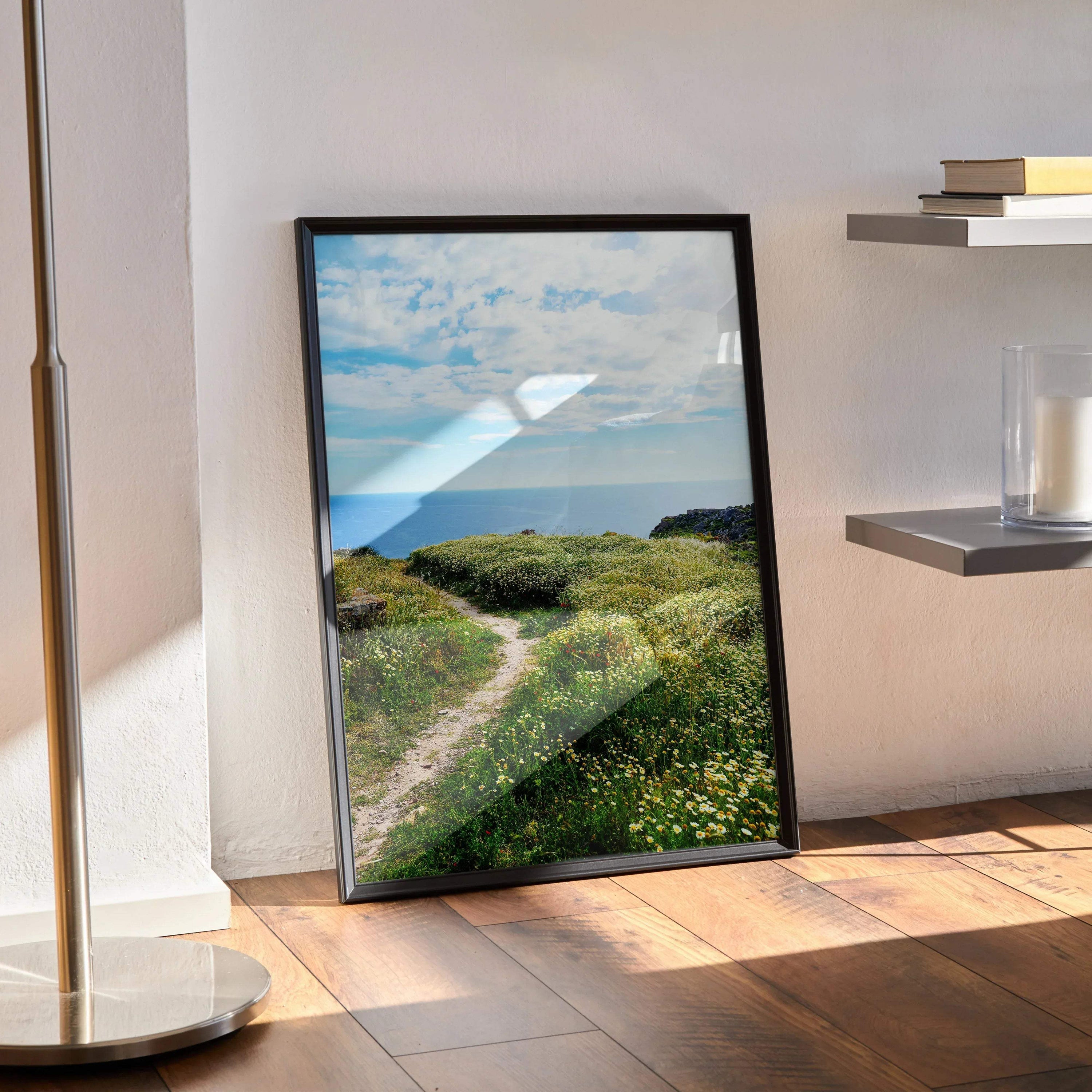 Vibrant floral nature scene poster with green path and blue sky wall art in black frame.