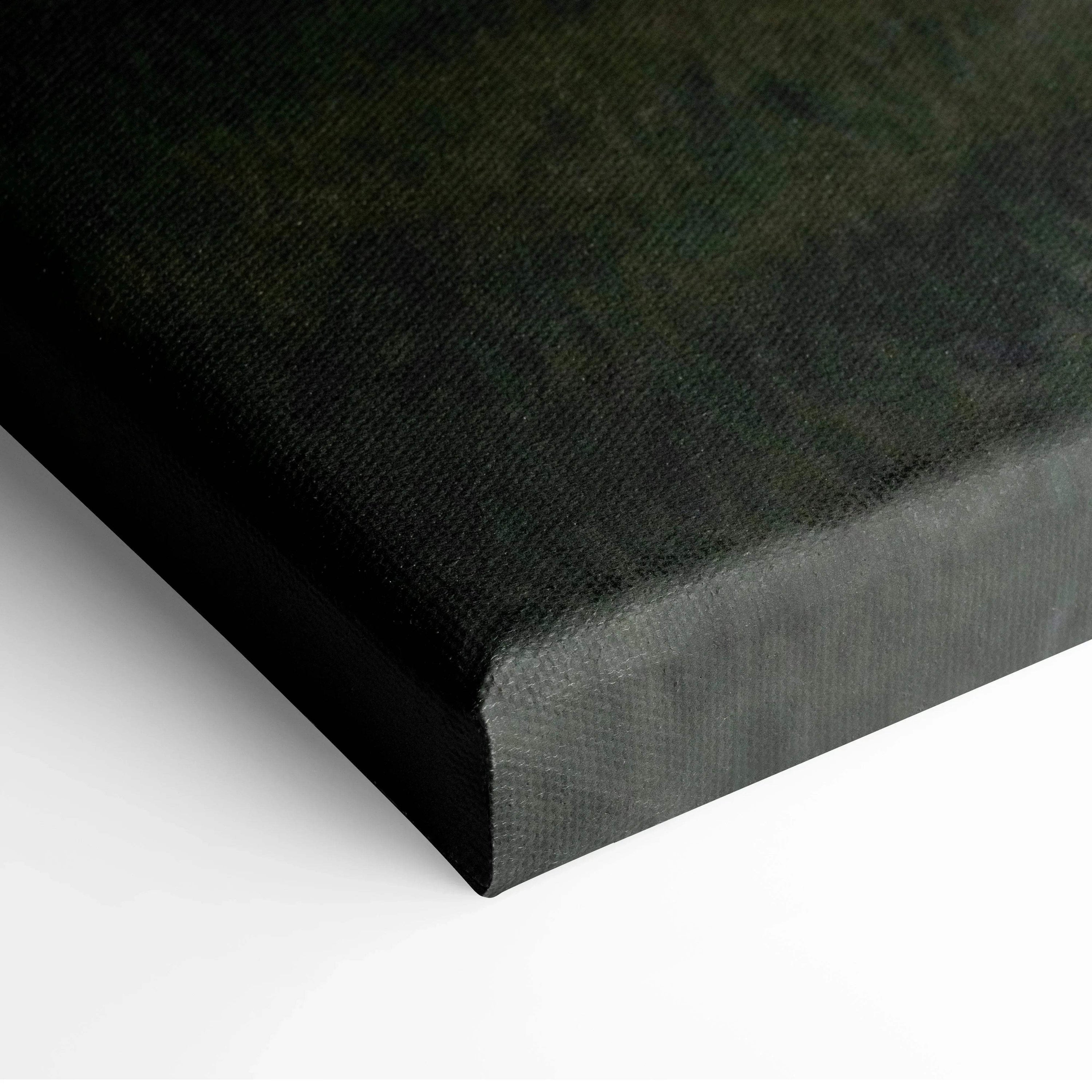 Corner close-up of black canvas wall art with textured fabric and wrapped edges.