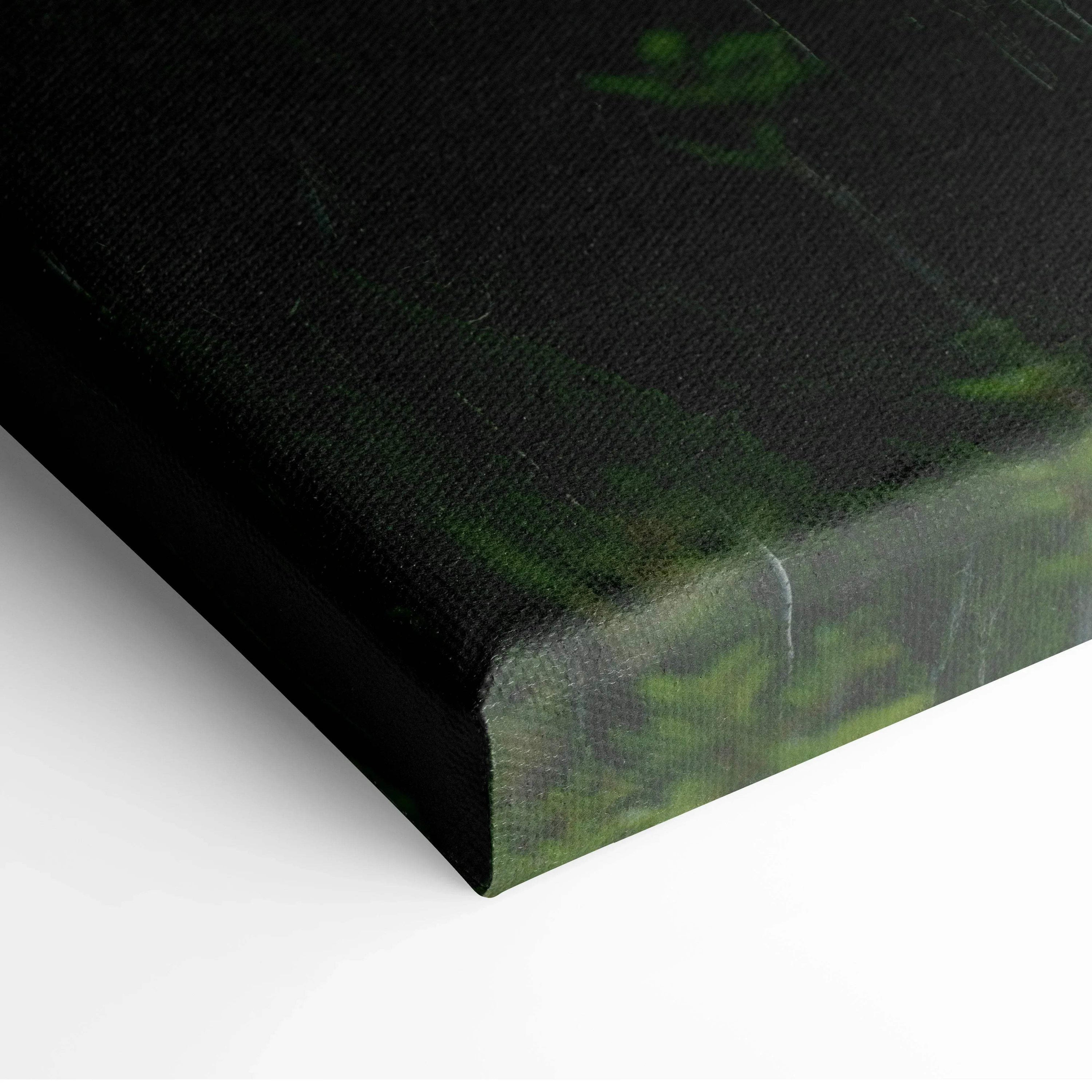 Close-up of green and black abstract canvas wall art corner with textured fabric surface.