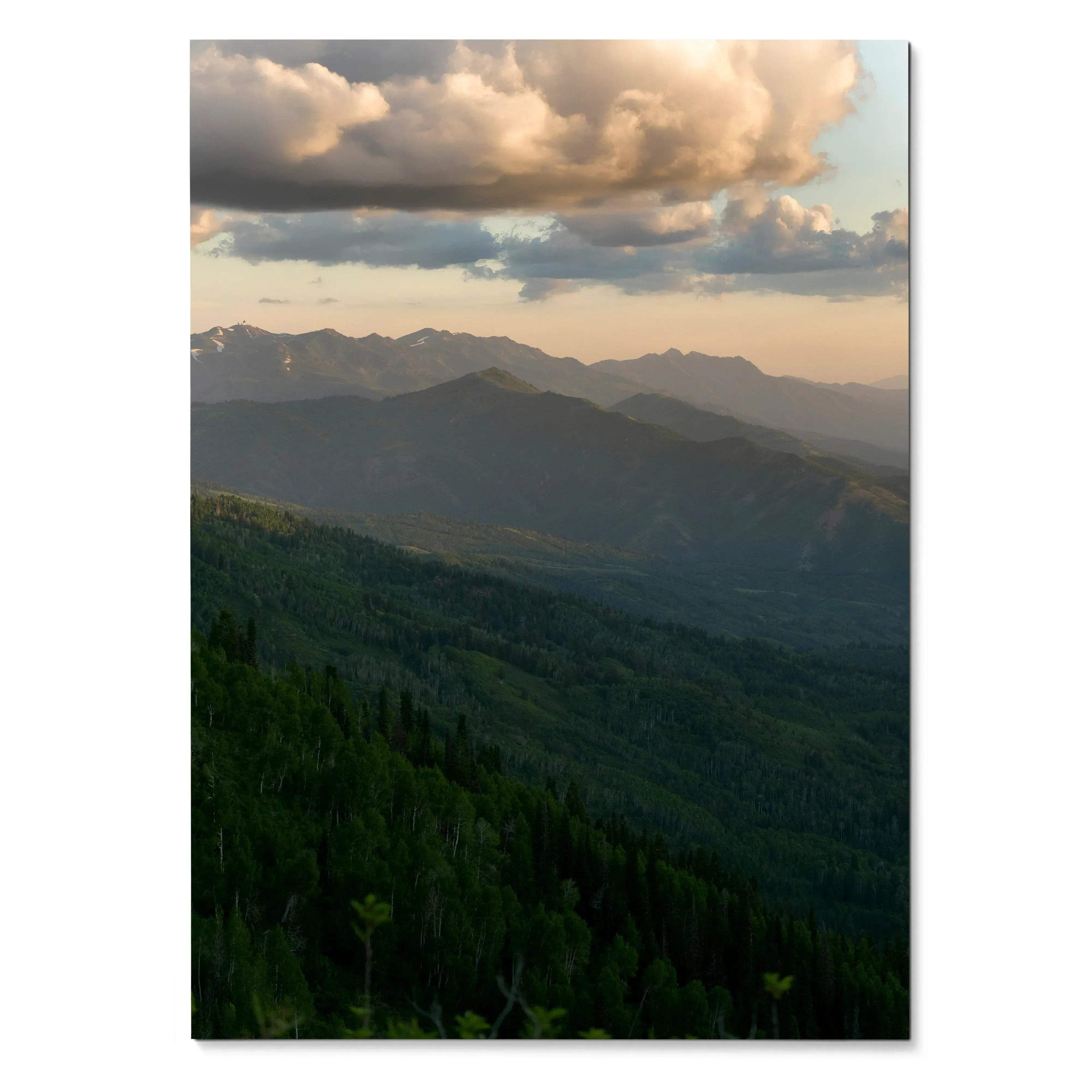 Vertical poster of layered mountain ridges under dramatic clouds at sunset, nature wall art.
