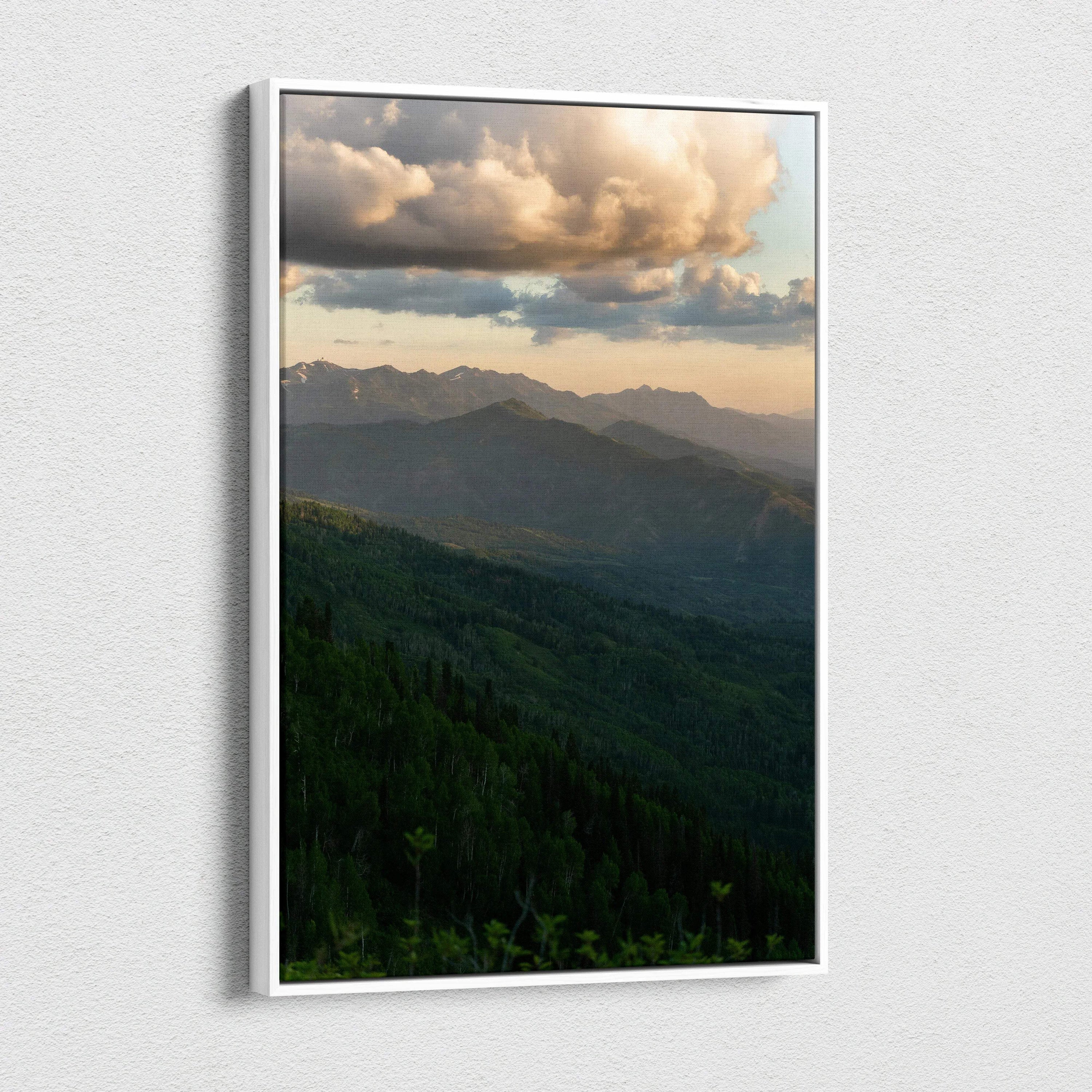 Vertical canvas wall art featuring a serene mountain landscape at sunset with dramatic clouds.