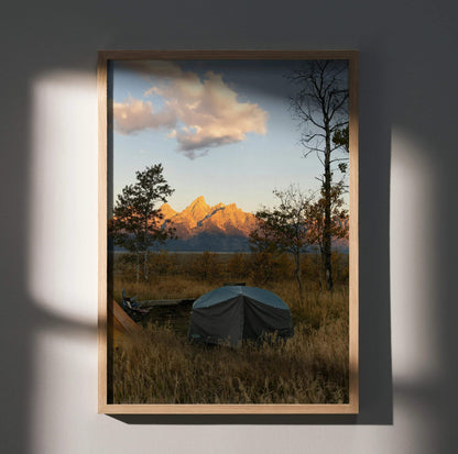 Vertical wall art poster featuring majestic mountain peaks at sunset with warm golden light and a foreground tent in a.