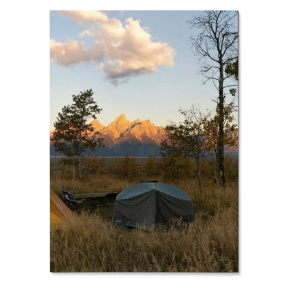 Vertical poster wall art featuring golden sunset light on majestic mountain peaks with foreground tents and autumn trees.