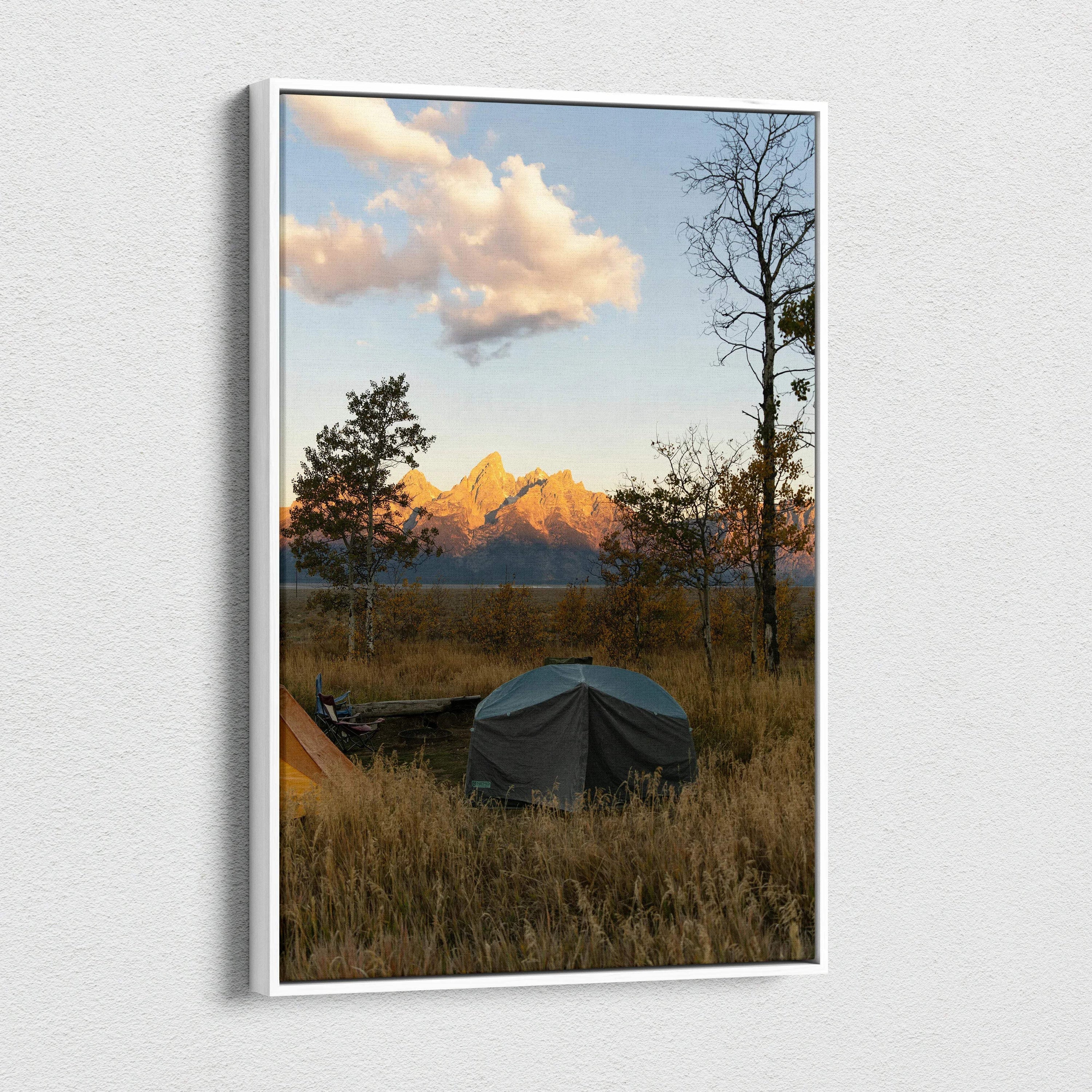 Canvas wall art featuring a sunset over mountains with tents and autumn trees.