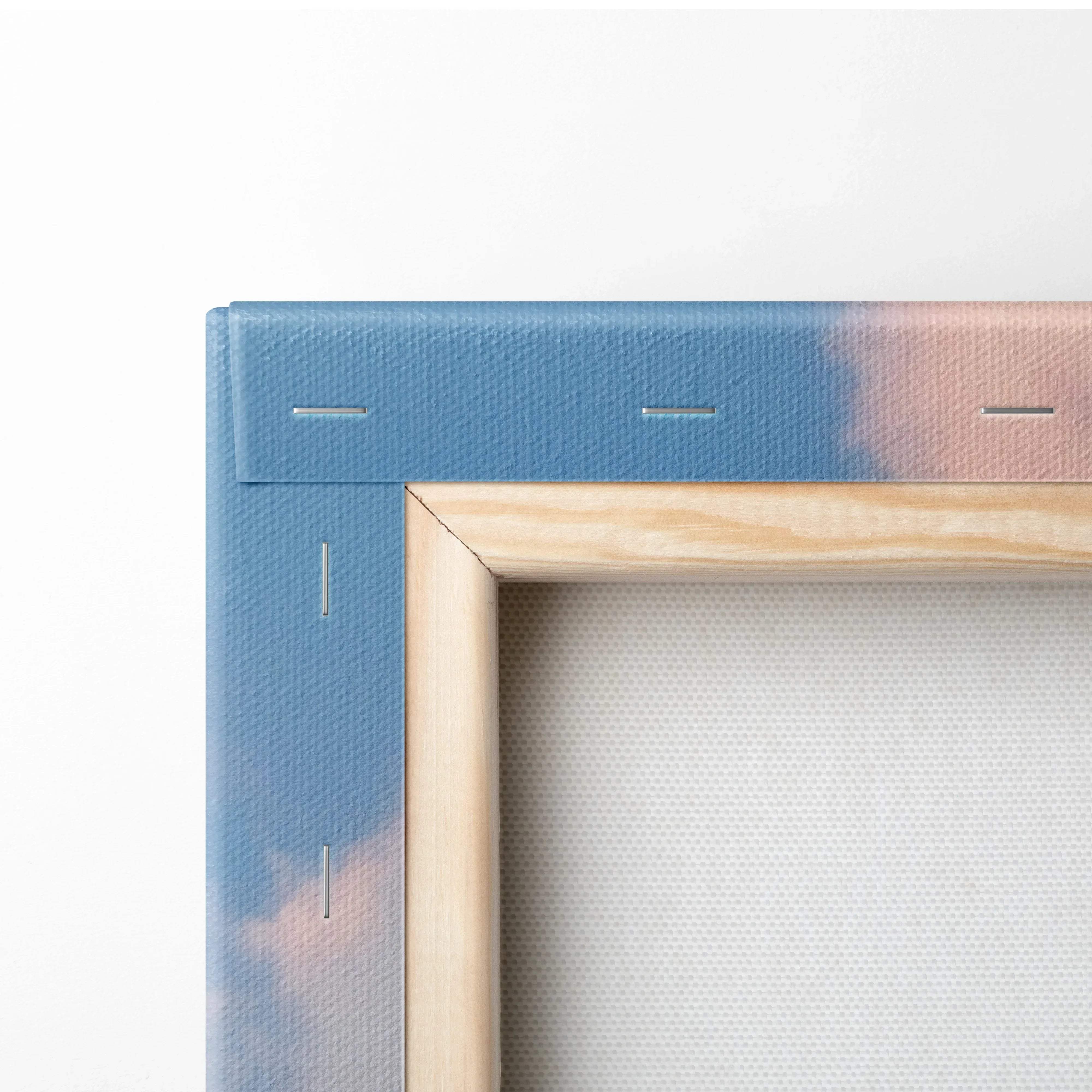 Modern cityscape canvas wall art with blue and pink gradient and light wood frame showcasing urban architecture