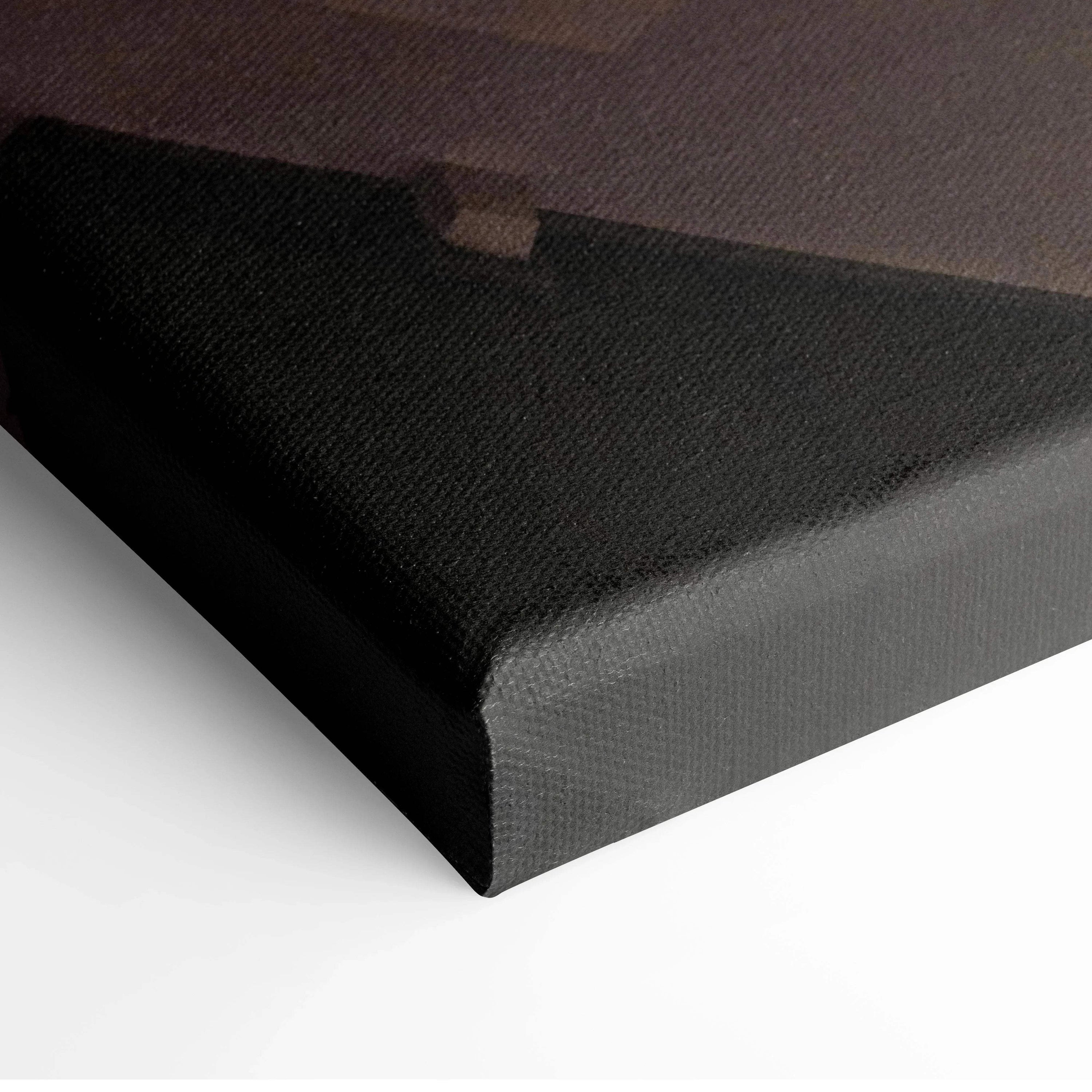 Black-edged canvas corner detail of urban architecture wall art with textured surface.