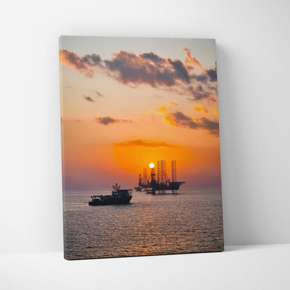 Ocean sunset canvas wall art with vibrant orange sky and silhouetted ships on calm water.