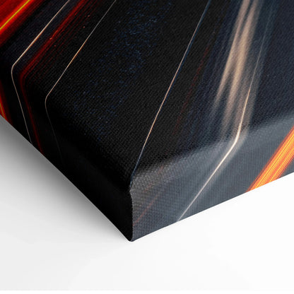 Close-up of vibrant urban cityscape canvas wall art corner with dark tones and bright orange highlights.