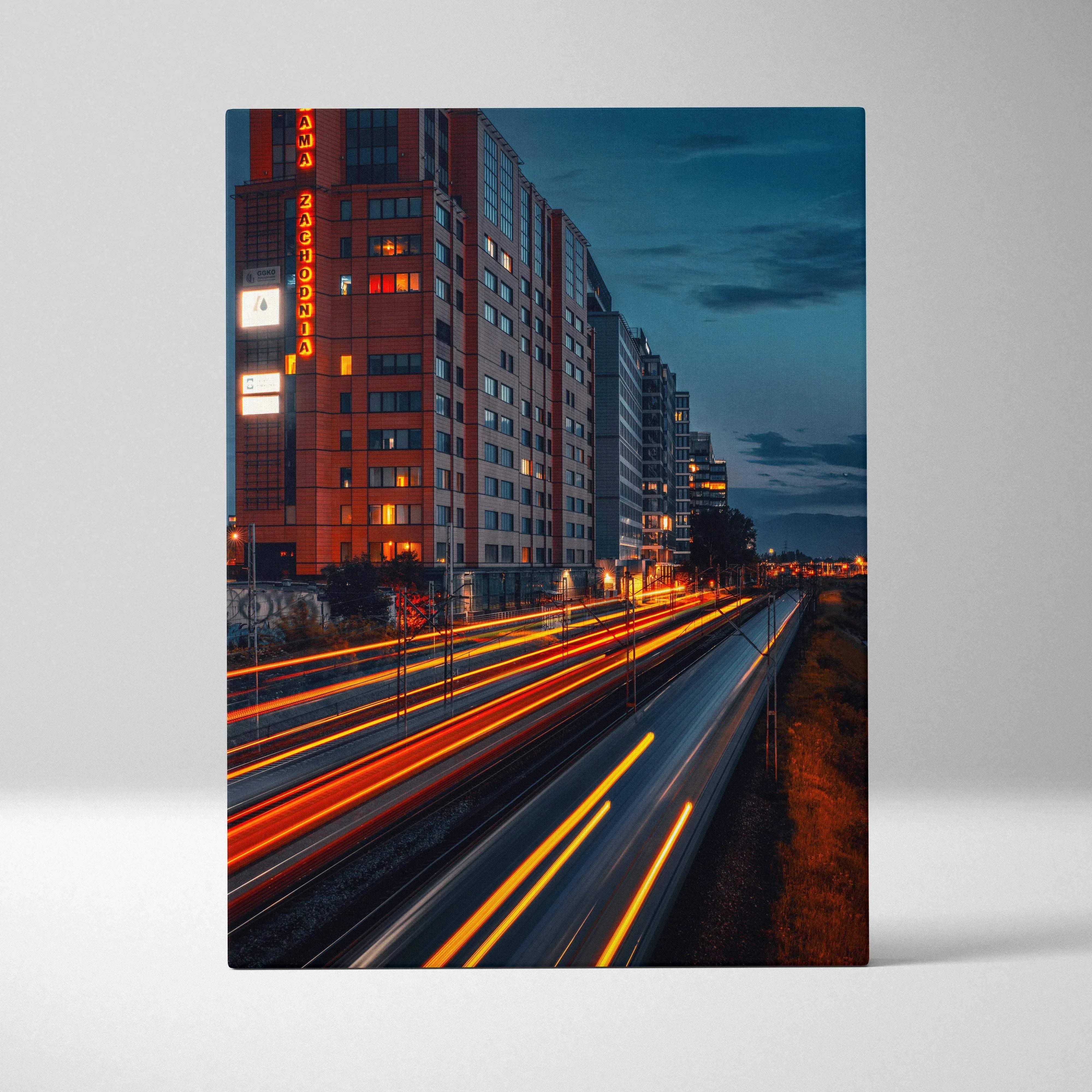 A rectangular canvas print of a nighttime cityscape with warm neon light trails over city streets wall art
