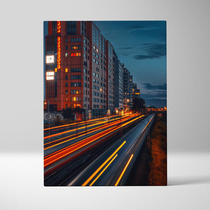 Urban cityscape canvas wall art with vibrant light trails and modern buildings at dusk.