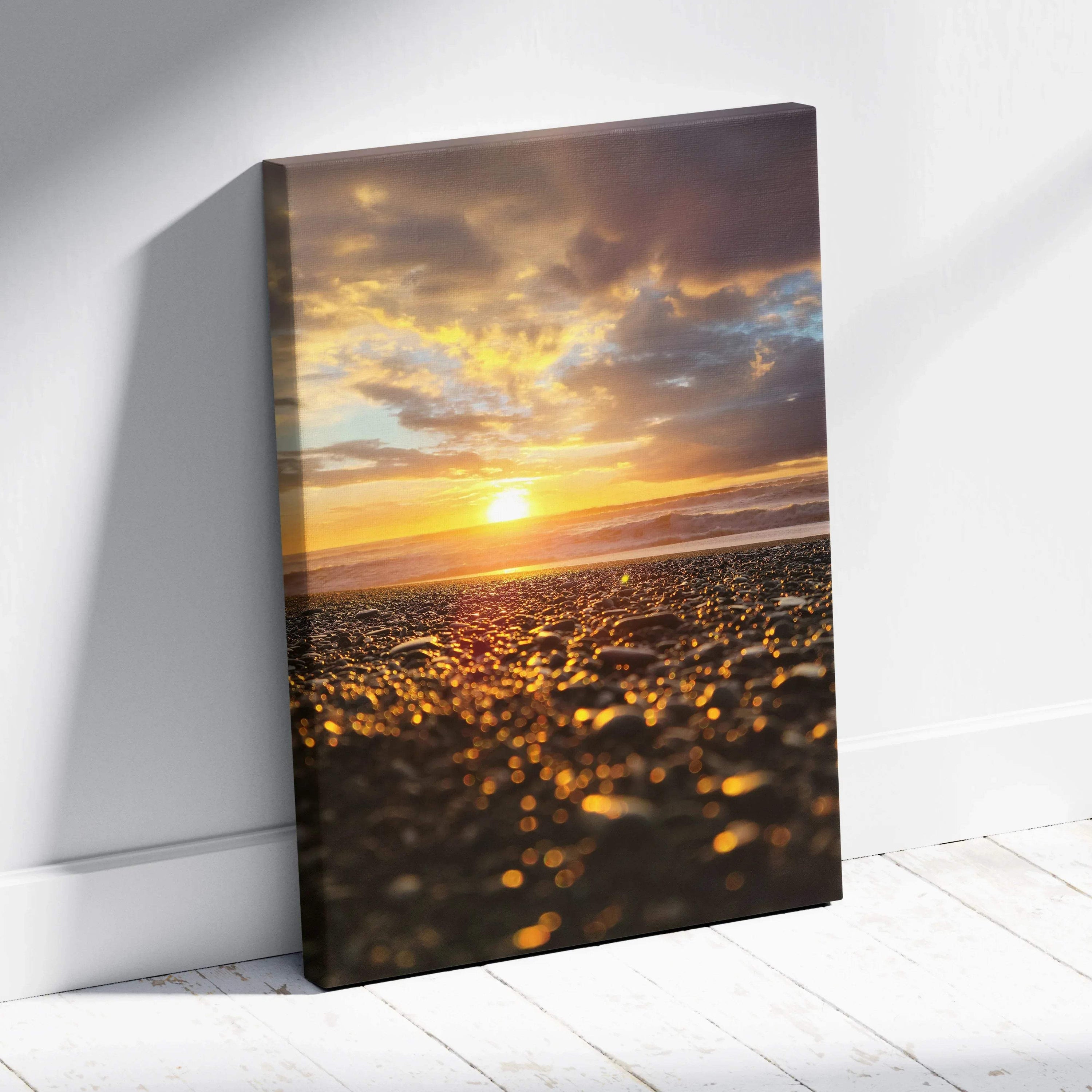 Canvas wall art featuring a glowing beach sunset with golden light reflecting on wet sand.