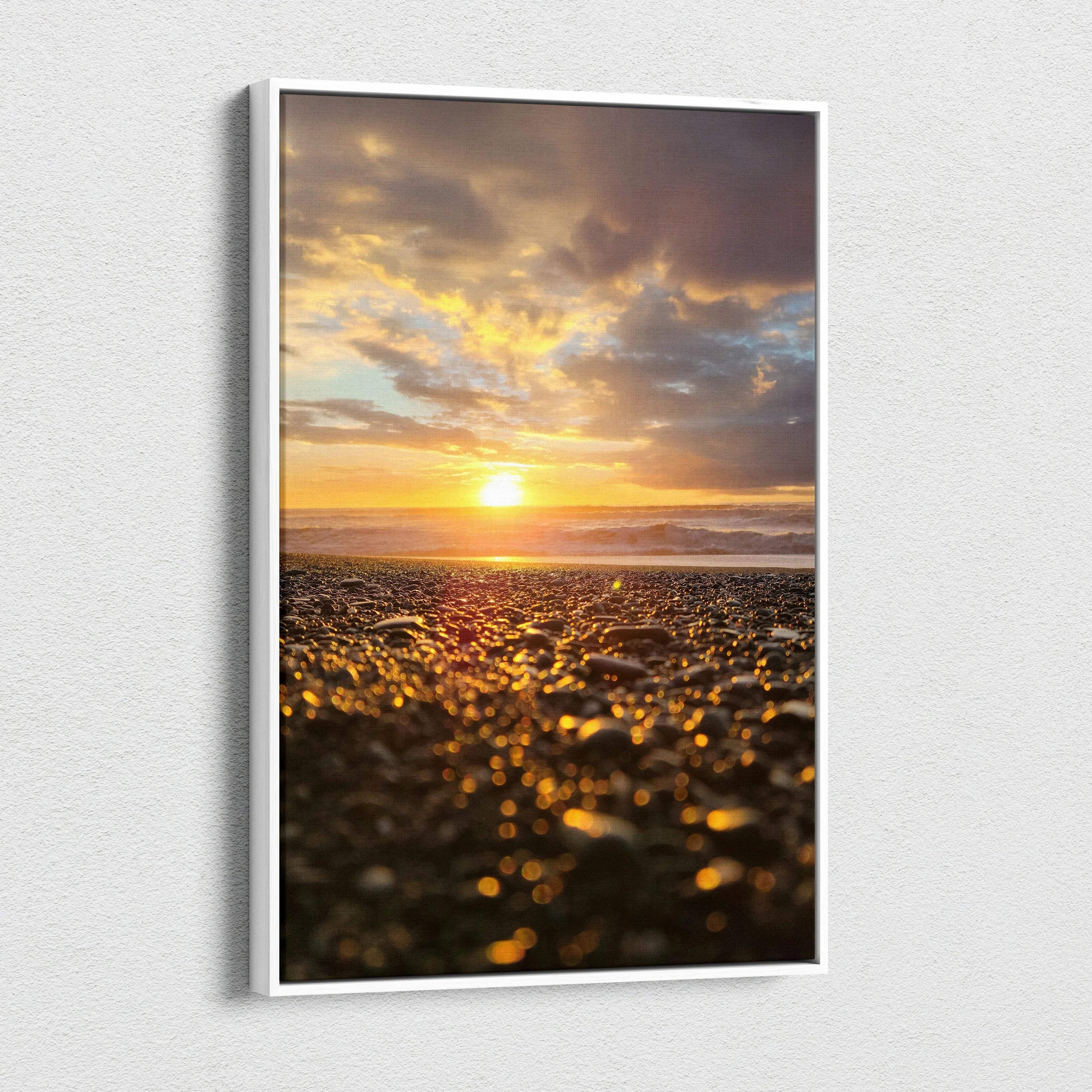 Vertical canvas wall art featuring a vibrant beach sunset with golden sunlight and cloudy sky.