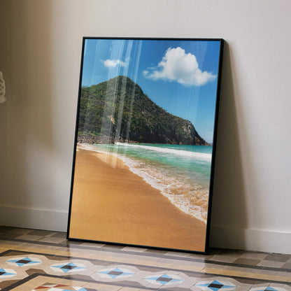 Serene beach and ocean waves poster with mountain backdrop in vertical wall art frame.