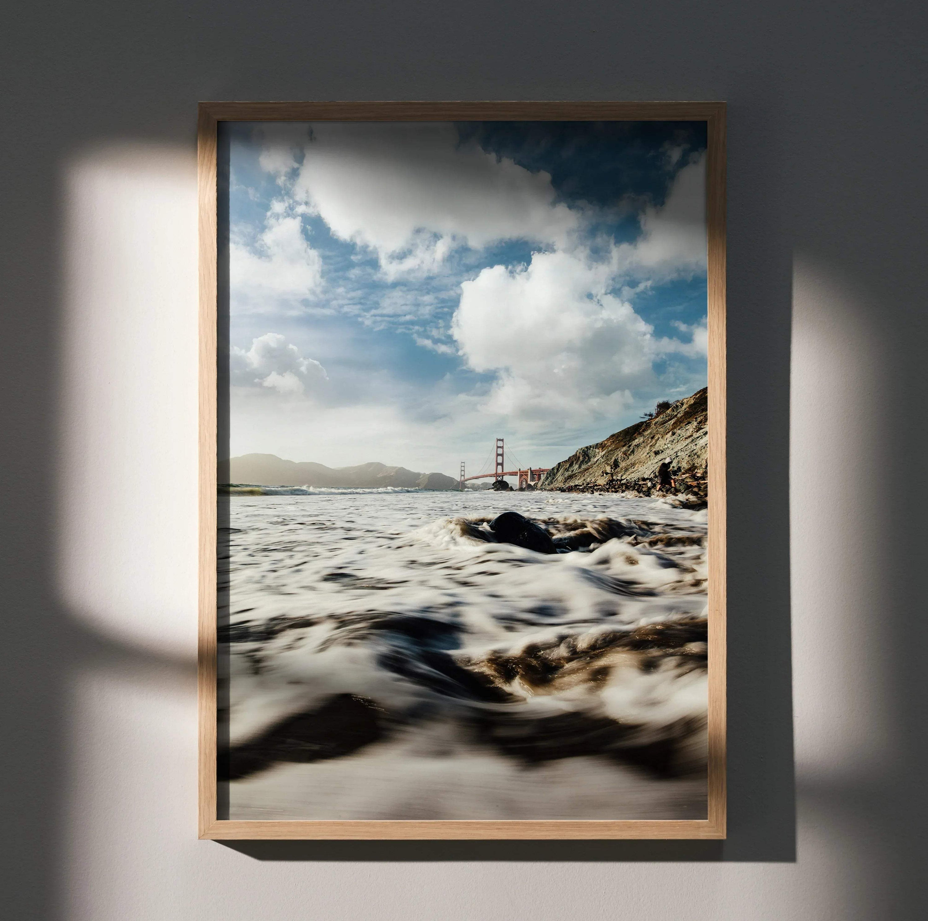 Vertical wall art poster featuring Golden Gate Bridge with ocean waves and cloudy sky.