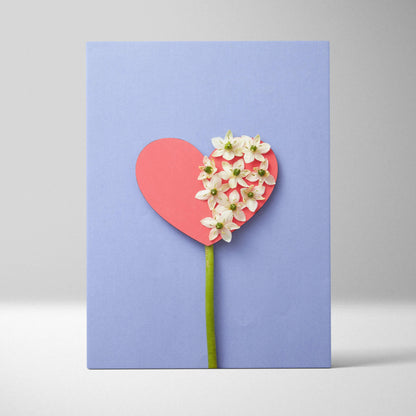 Pastel blue heart canvas wall art with white flowers on coral paper, lavender background