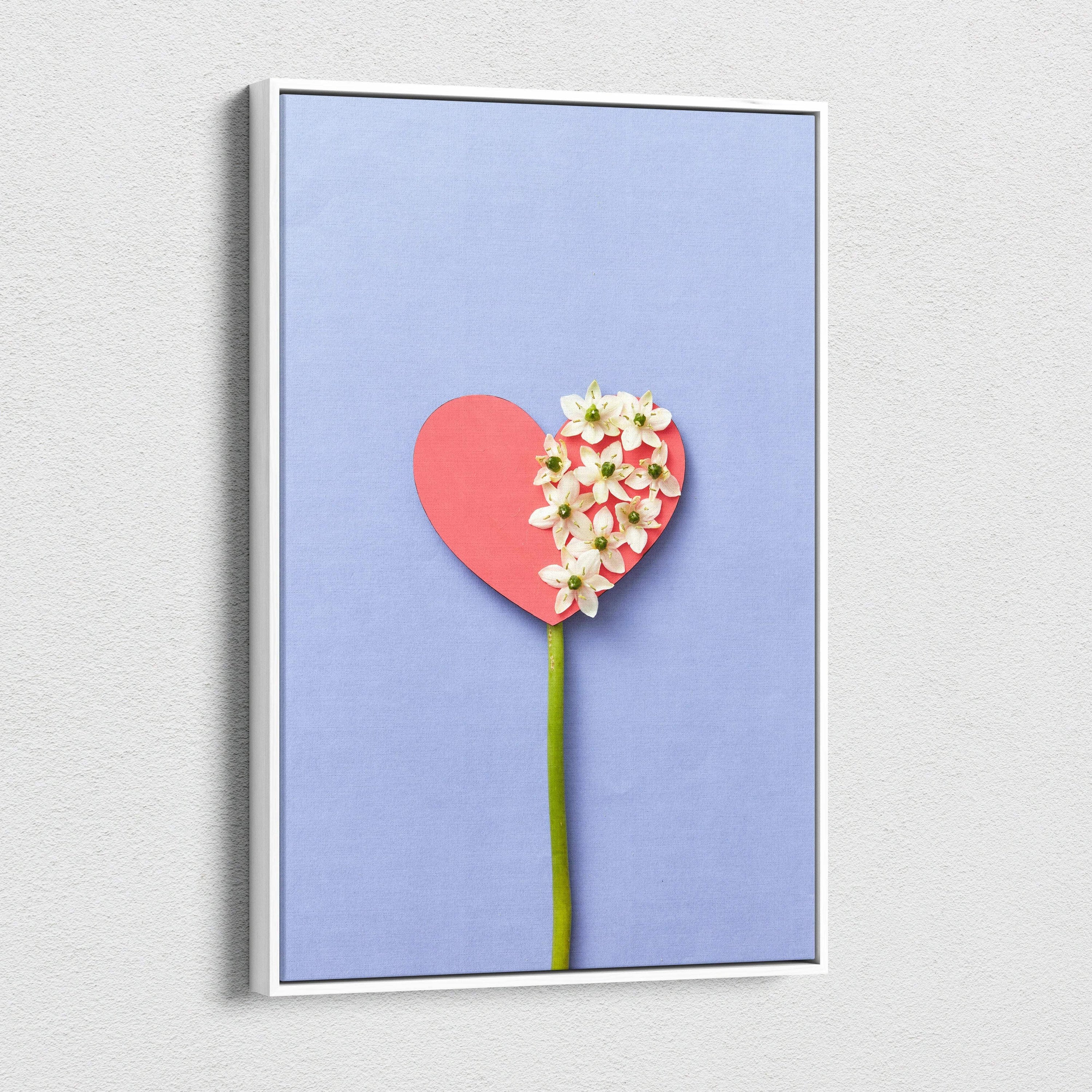 Pastel blue heart canvas wall art with white flowers on lavender background