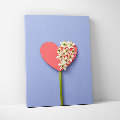 Pastel blue heart canvas wall art with white flowers and green stem