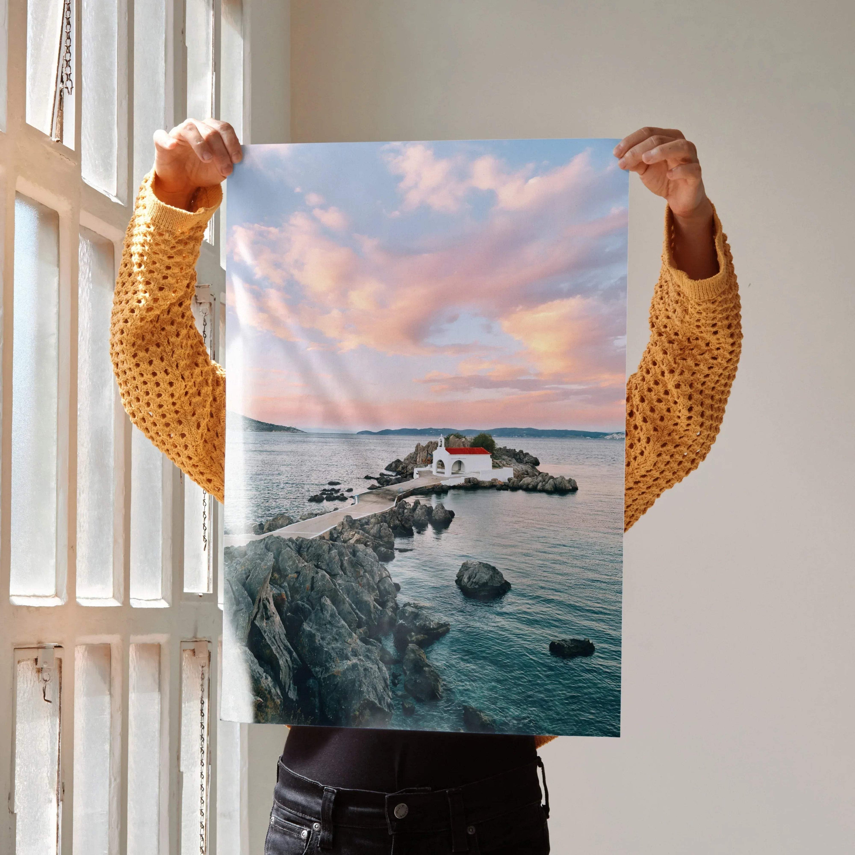 Vertical beach sunset poster featuring calm water, rocky pier, and small lighthouse wall art.