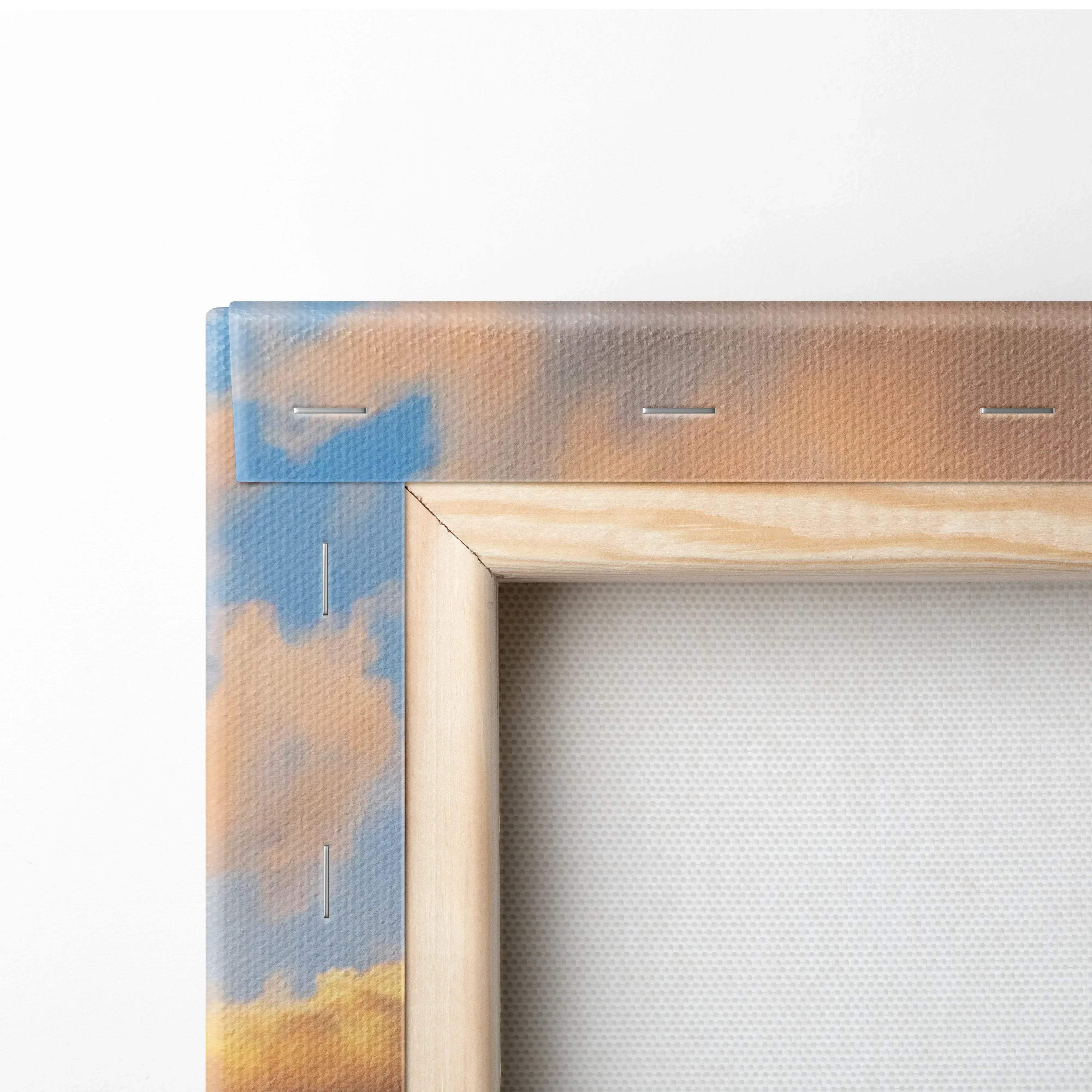 A wooden-framed canvas wall art featuring a tranquil sunset sky with soft blue and golden hues stitched along edges