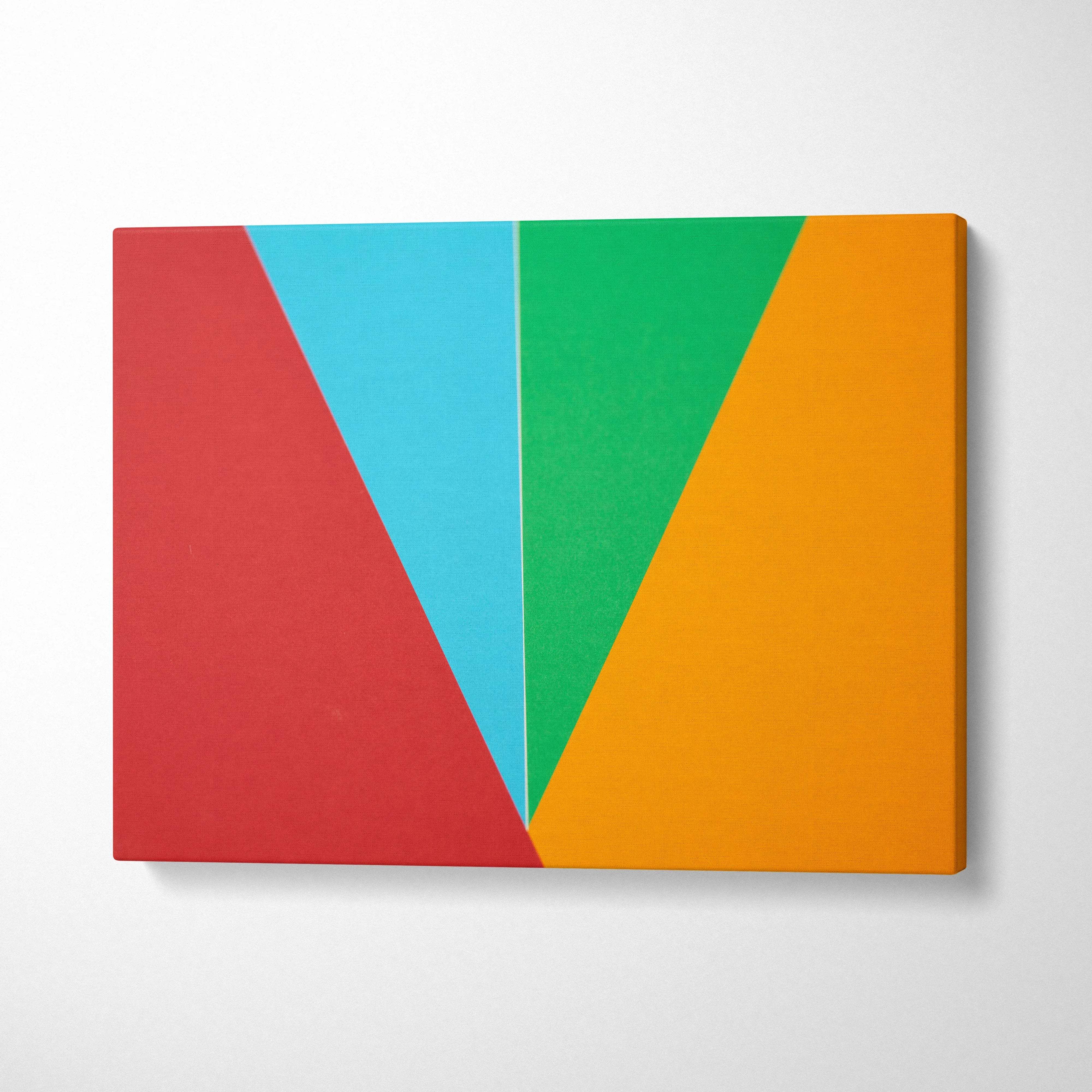Vibrant geometric abstract canvas art with bold overlapping red cyan green orange triangles