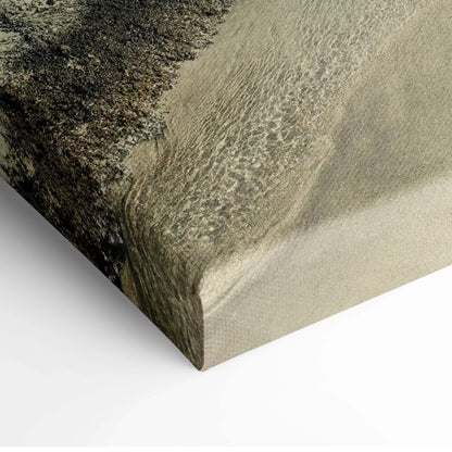 Canvas wall art featuring textured close-up of sandy beach and flowing water.