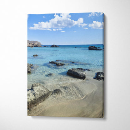 Beach scene with clear water and rocks on canvas wall art print.