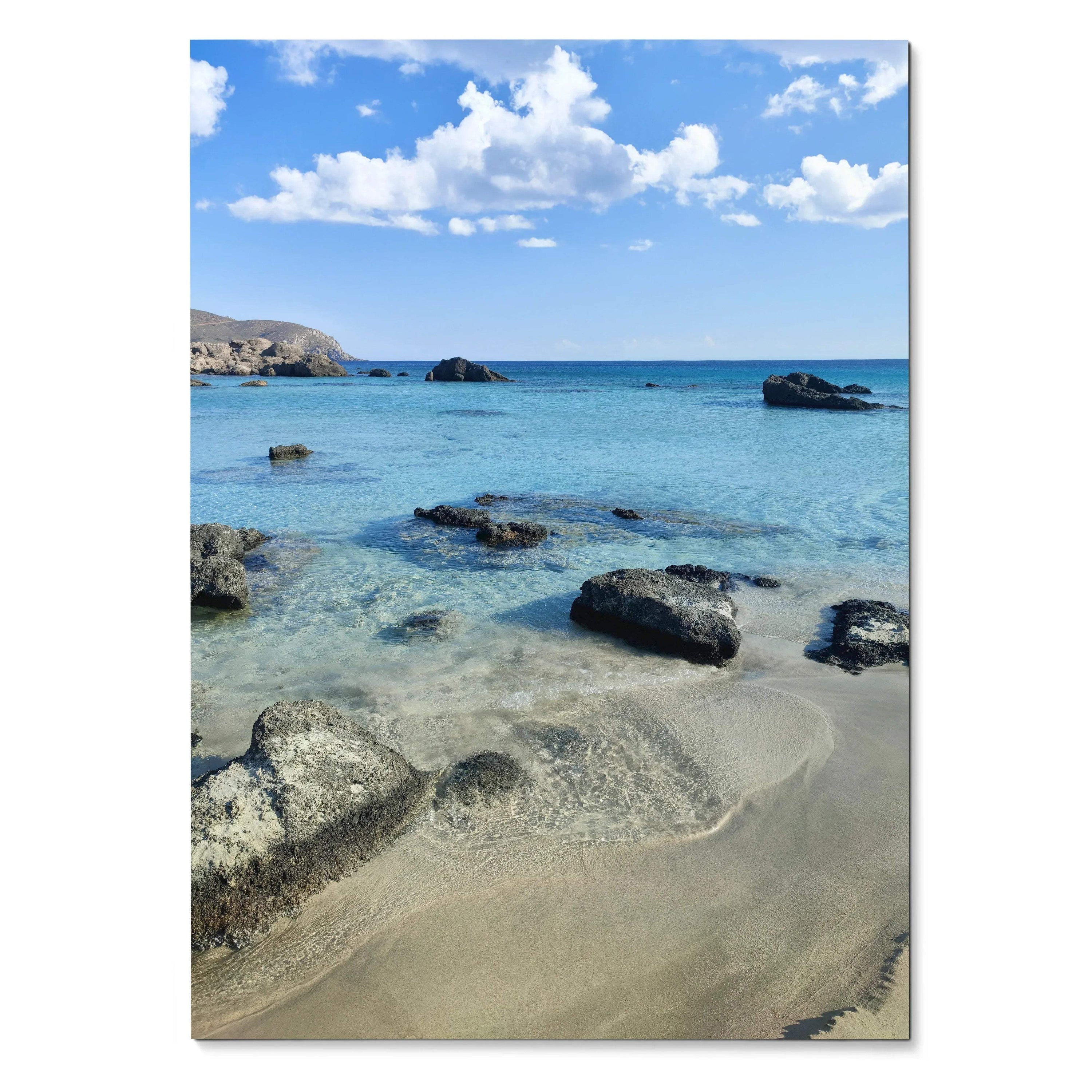 Vertical beach landscape poster featuring clear blue water, sandy shore, and scattered rocks, wall art with vibrant sky and.