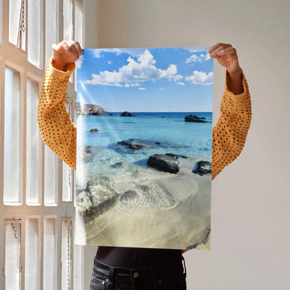 Beach landscape poster with clear blue water, sandy shore, and sky clouds wall art.