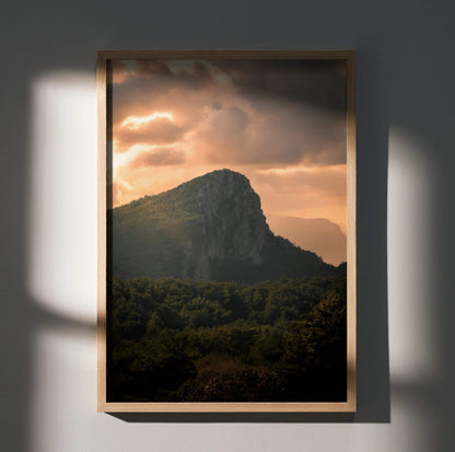 Vertical poster wall art of a majestic mountain silhouetted against a glowing sunset sky.