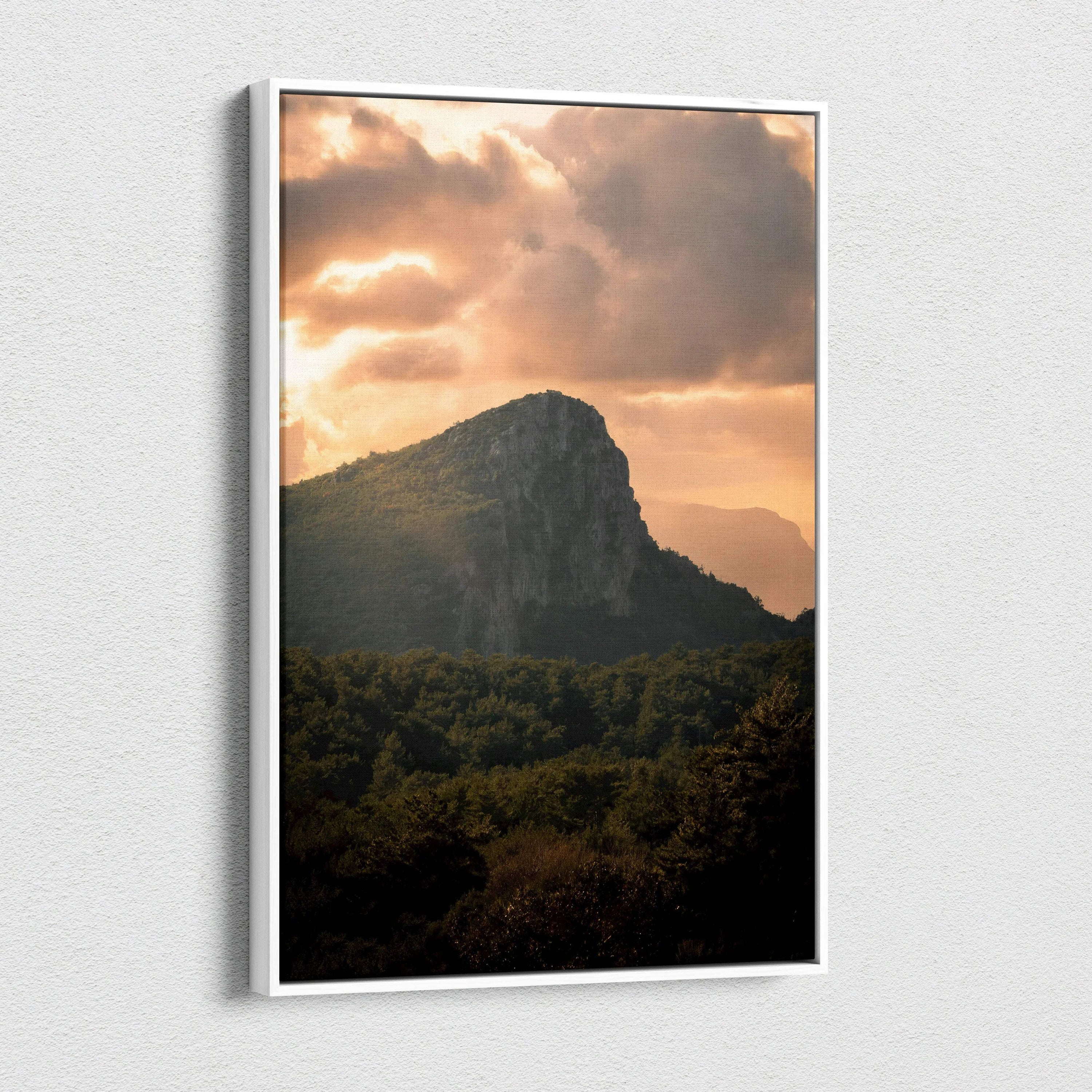 Majestic mountain sunset with glowing clouds on canvas wall art in vertical format.
