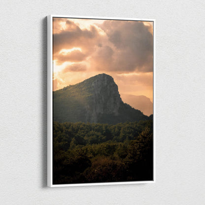 Majestic mountain sunset with glowing clouds on canvas wall art in vertical format.