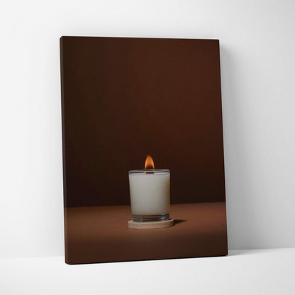 Minimalist white candle in glass jar with warm glow on brown canvas art