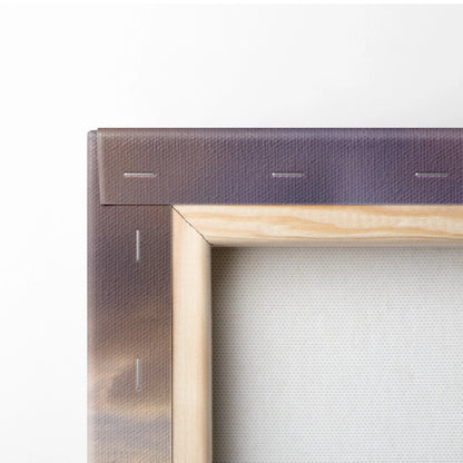 Close-up of wooden frame and canvas texture with vibrant sunset colors in vertical wall art.