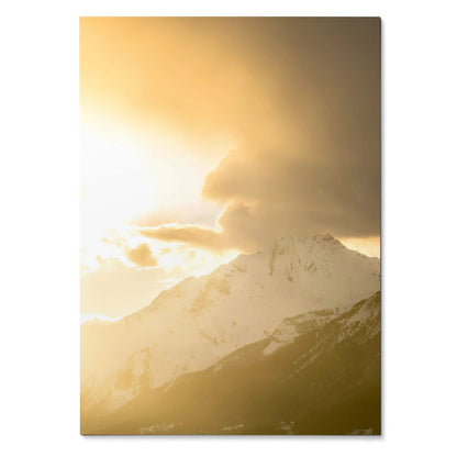 Vertical wall art poster of snowy mountain peaks under a golden sunset sky.