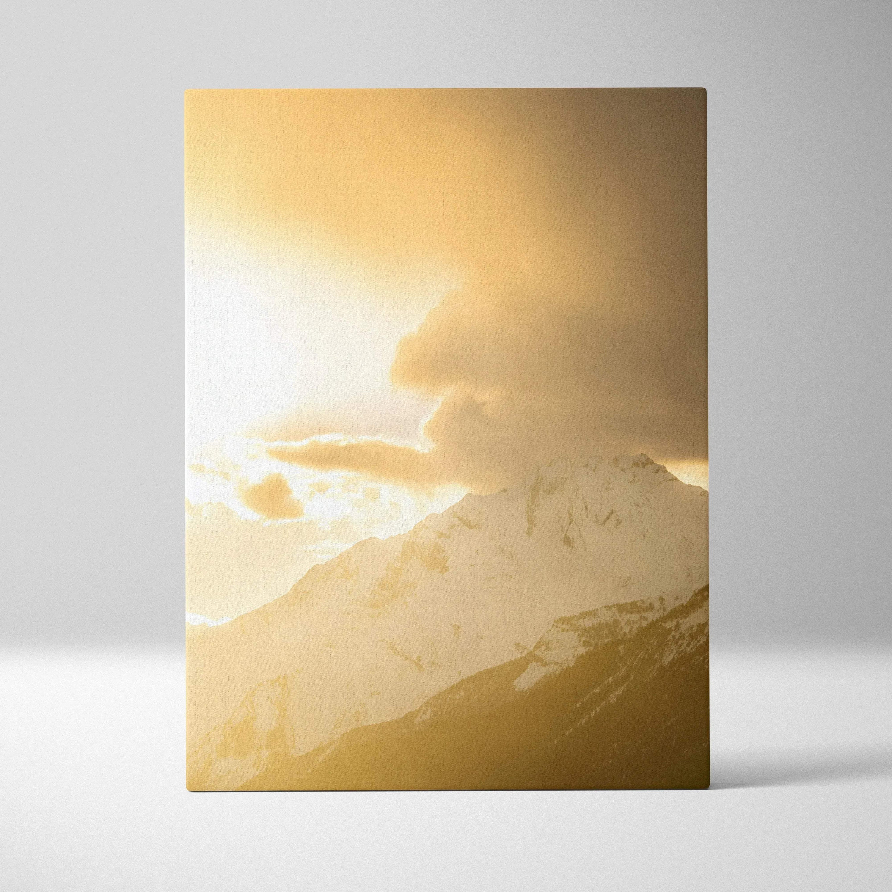 Canvas wall art featuring a golden mountain sunset with dramatic clouds over snow-capped peaks.