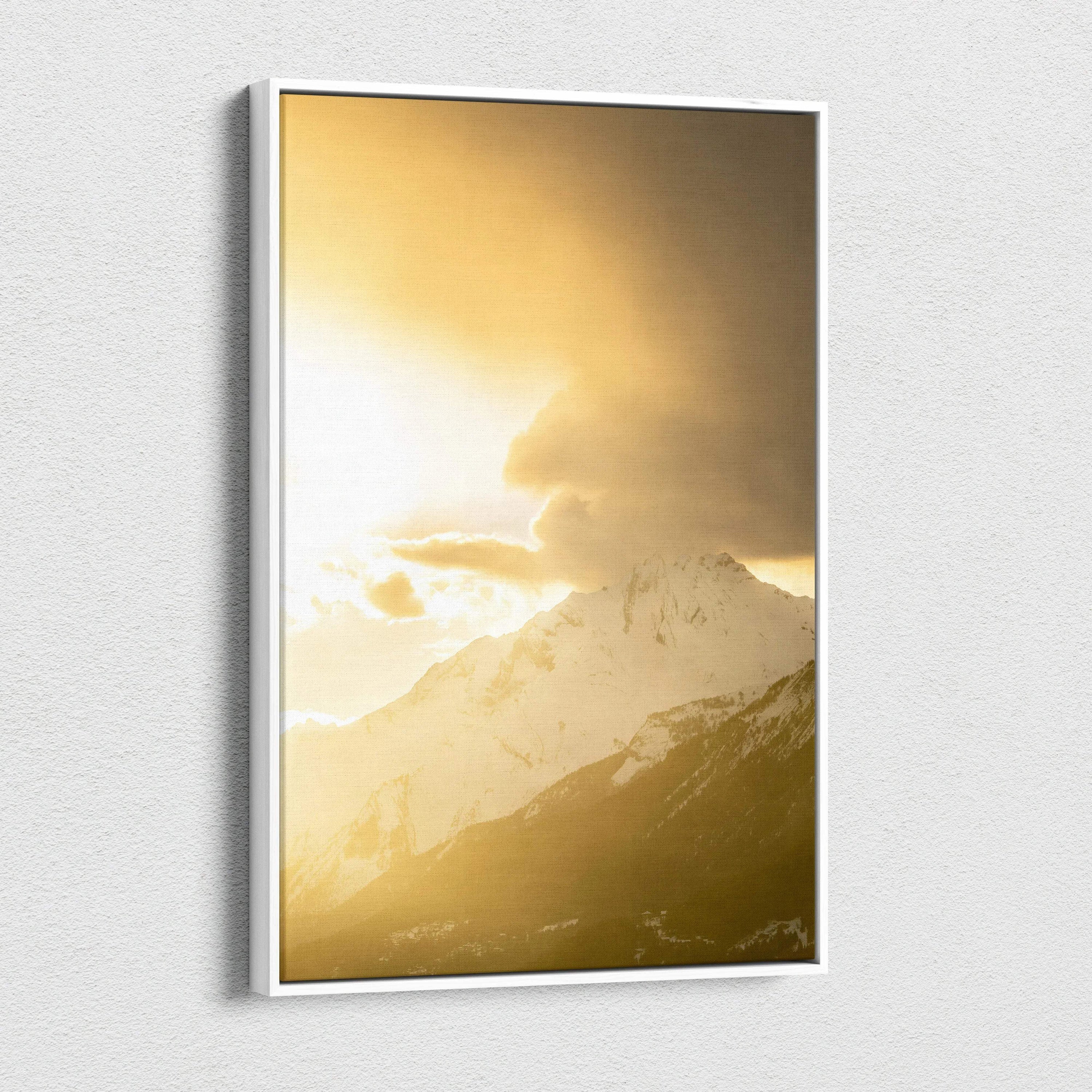 Vertical canvas wall art featuring a golden sunset over snow-capped mountains.