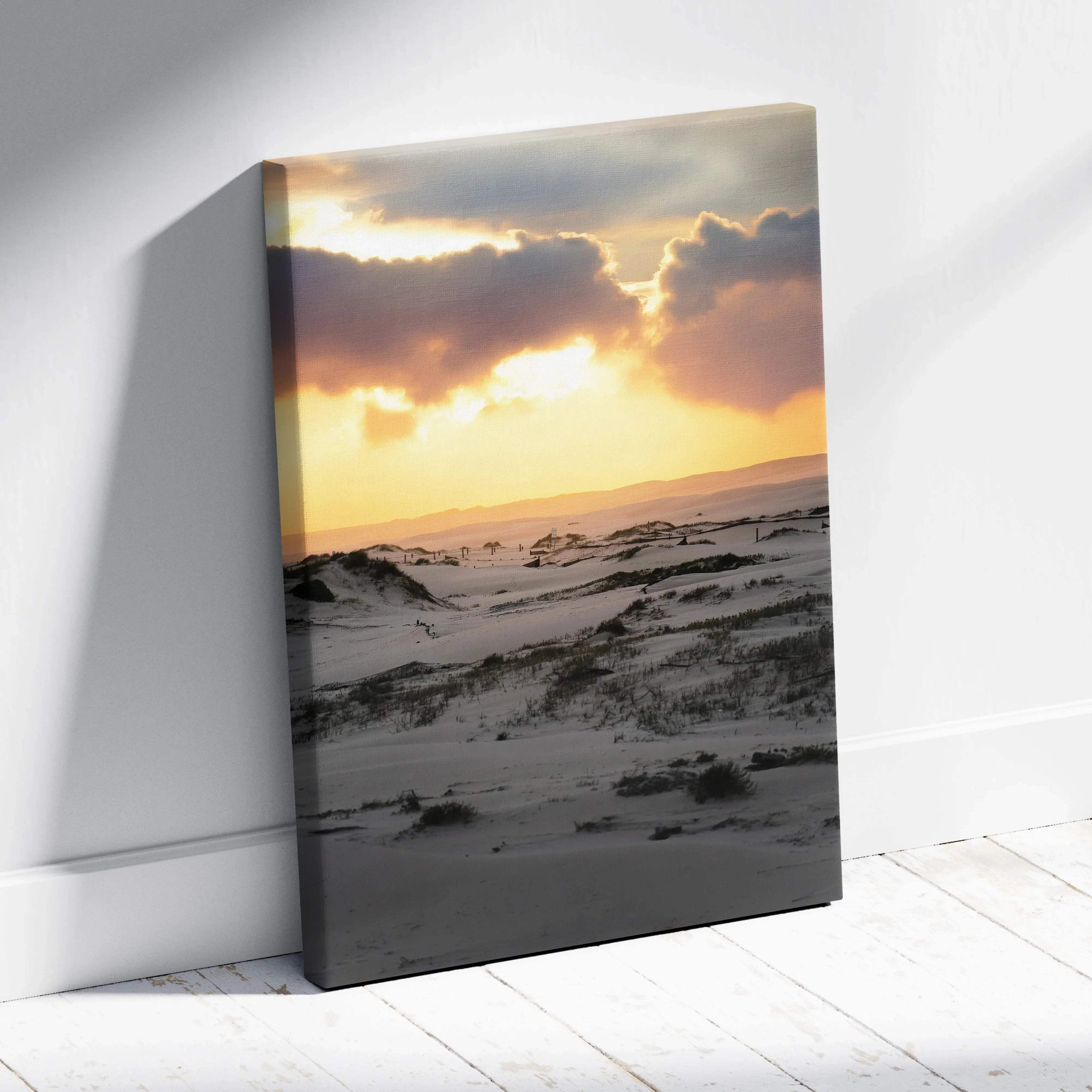 Canvas wall art depicting a snowy landscape at sunset with dramatic clouds and warm light.