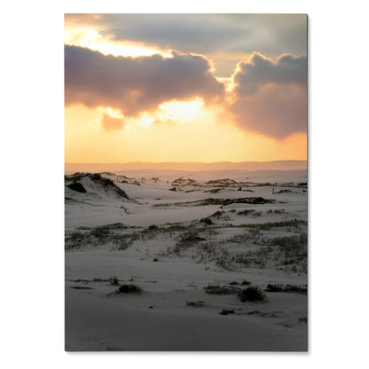 Vertical poster of snow-covered dunes under a glowing sunset sky, nature wall art.