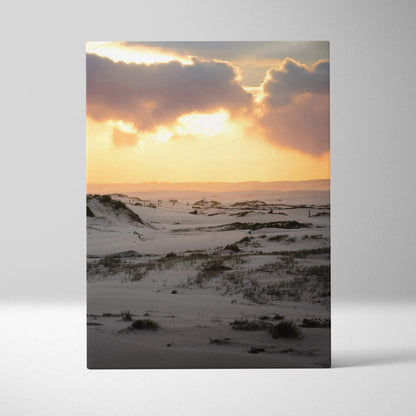 Snowy dunes at sunset with golden sky on vertical canvas wall art.