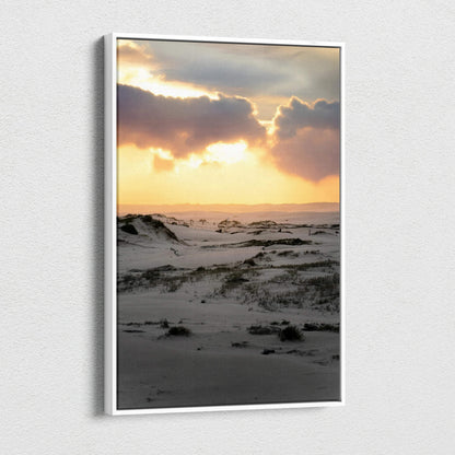 Snowy landscape at sunset with warm sky tones on vertical canvas wall art.