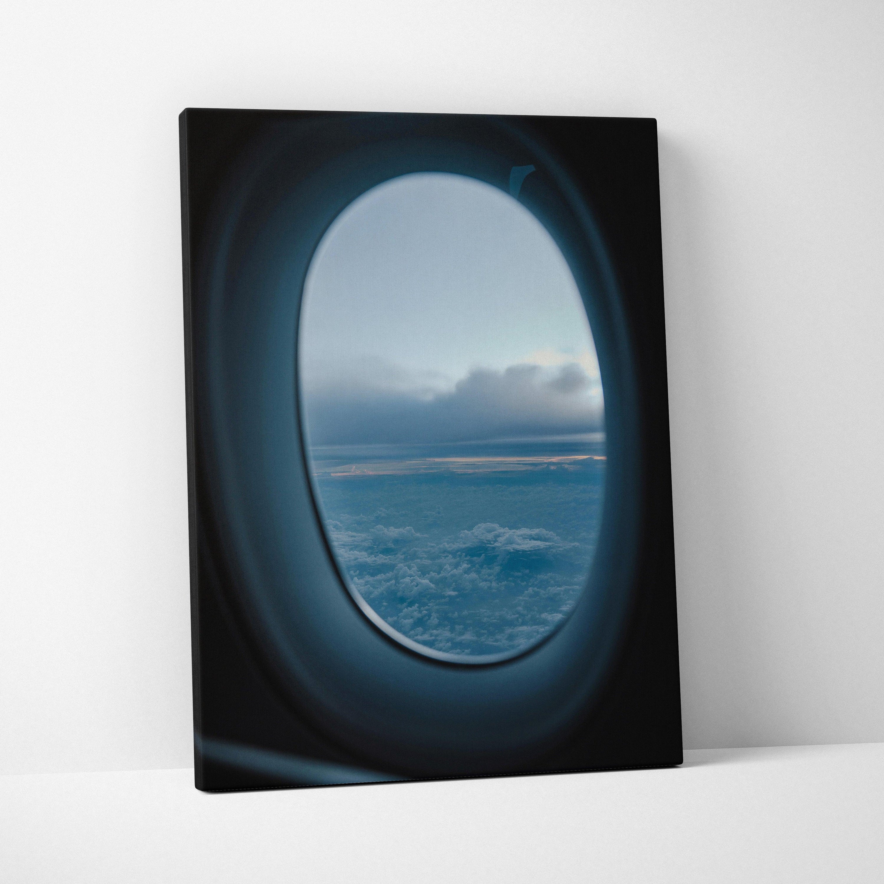 Canvas wall art featuring a serene airplane window view of clouds and sky at dusk.