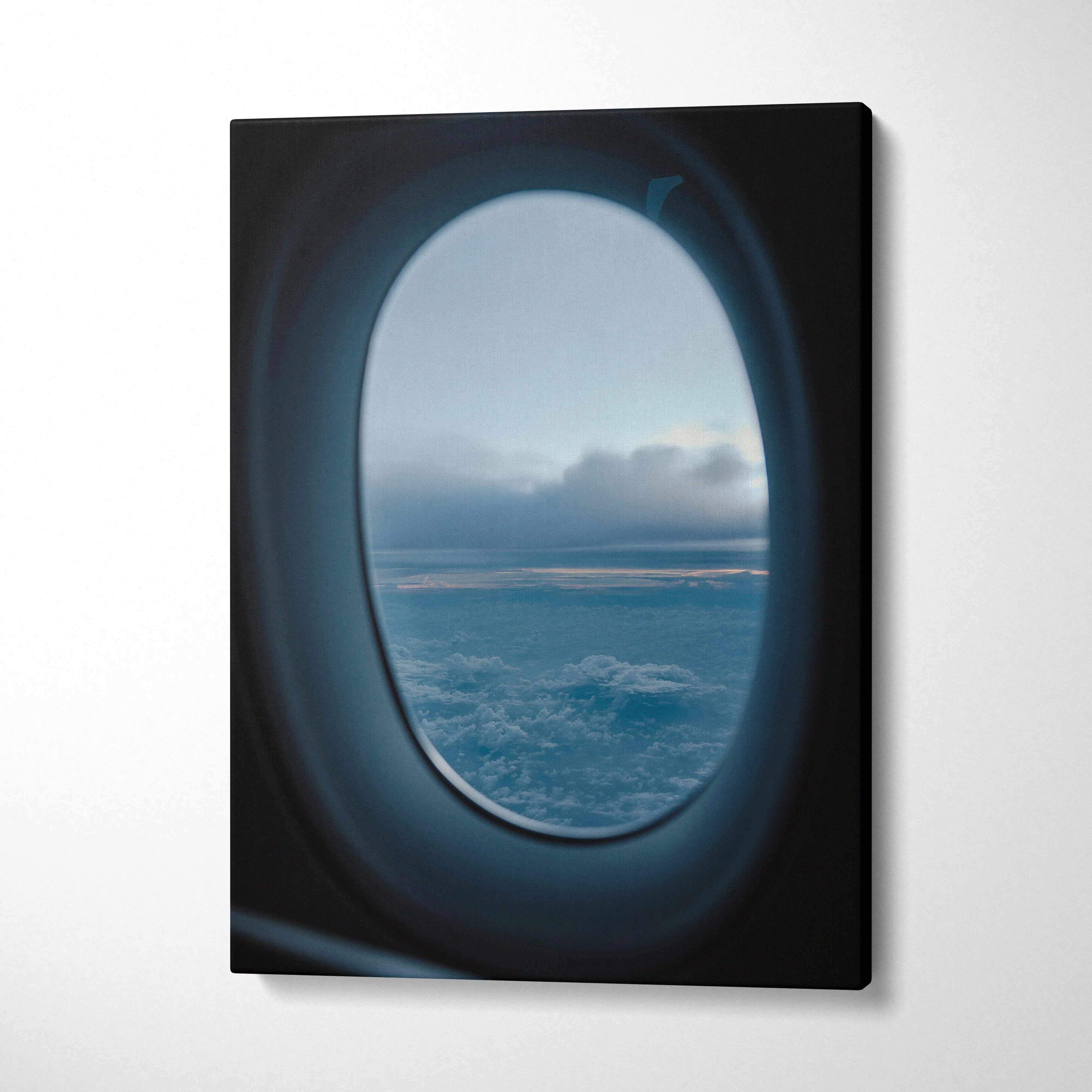 Canvas wall art featuring a serene airplane window view of clouds and sky at dusk.