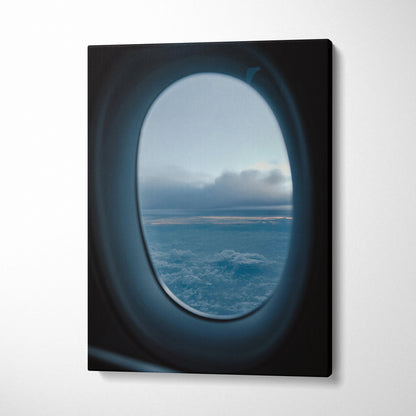 Canvas wall art featuring a serene airplane window view of clouds and sky at dusk.