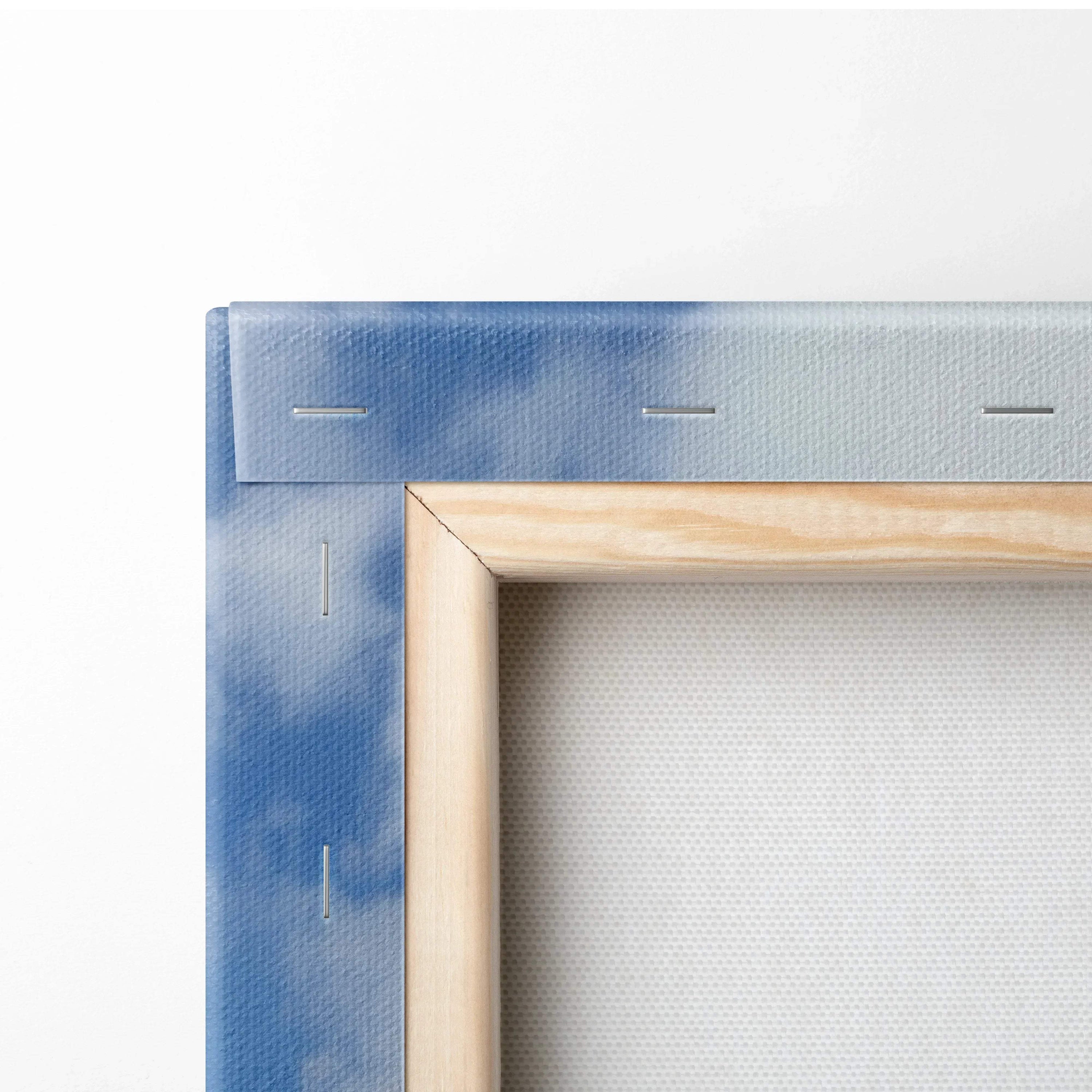 Close-up of wooden stretcher frame and blue painterly canvas edge for wall art canvas panel.