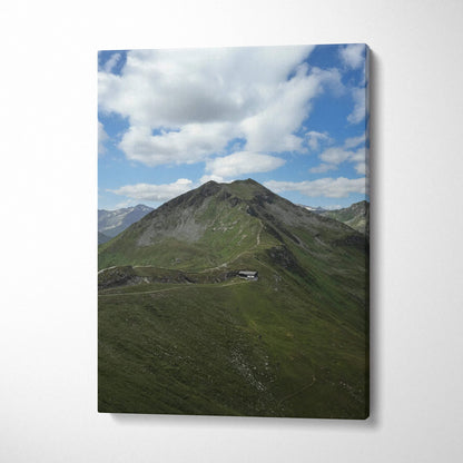 Canvas wall art featuring a green mountain peak under a partly cloudy blue sky.
