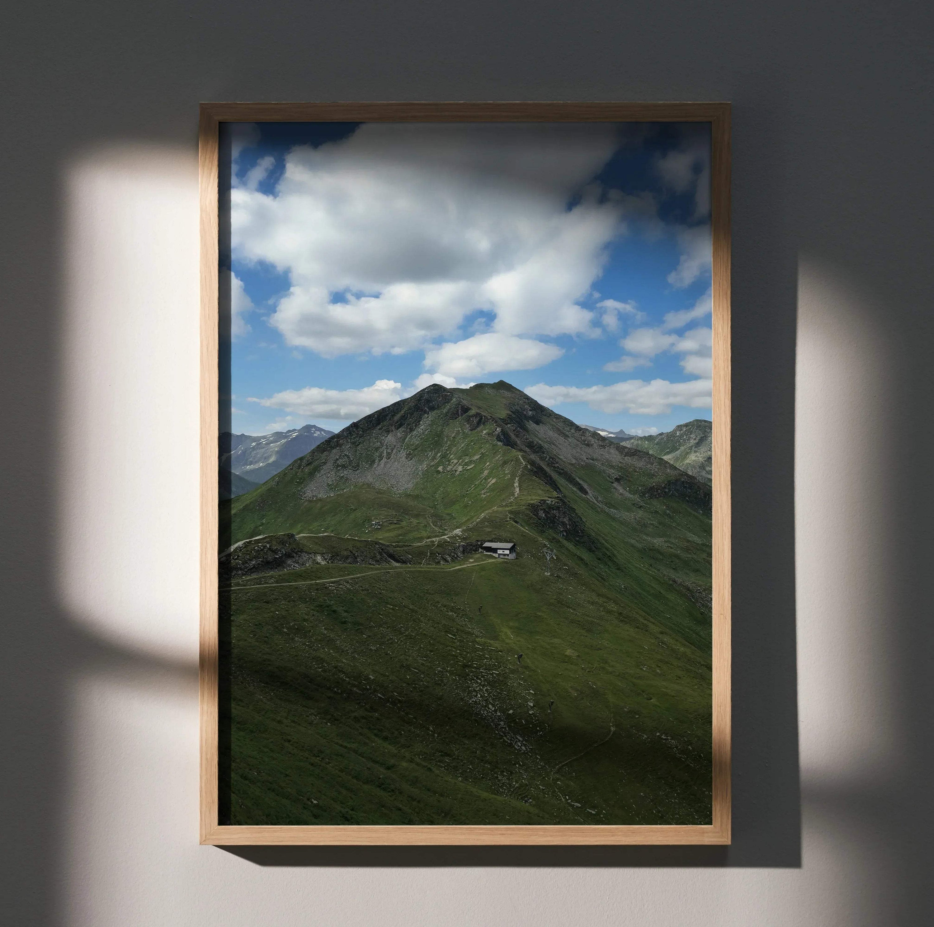 Vertical poster wall art featuring a dramatic green mountain under a cloudy blue sky.
