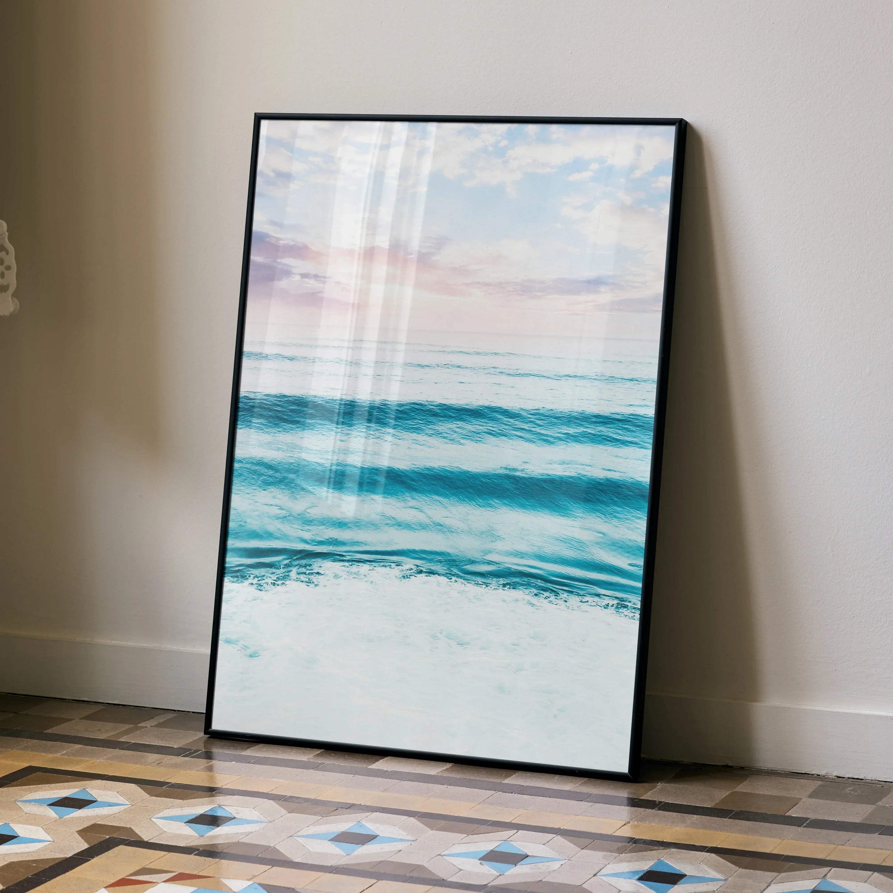 Ocean sunset poster with calming blue waves and soft pink sky, vertical wall art print.