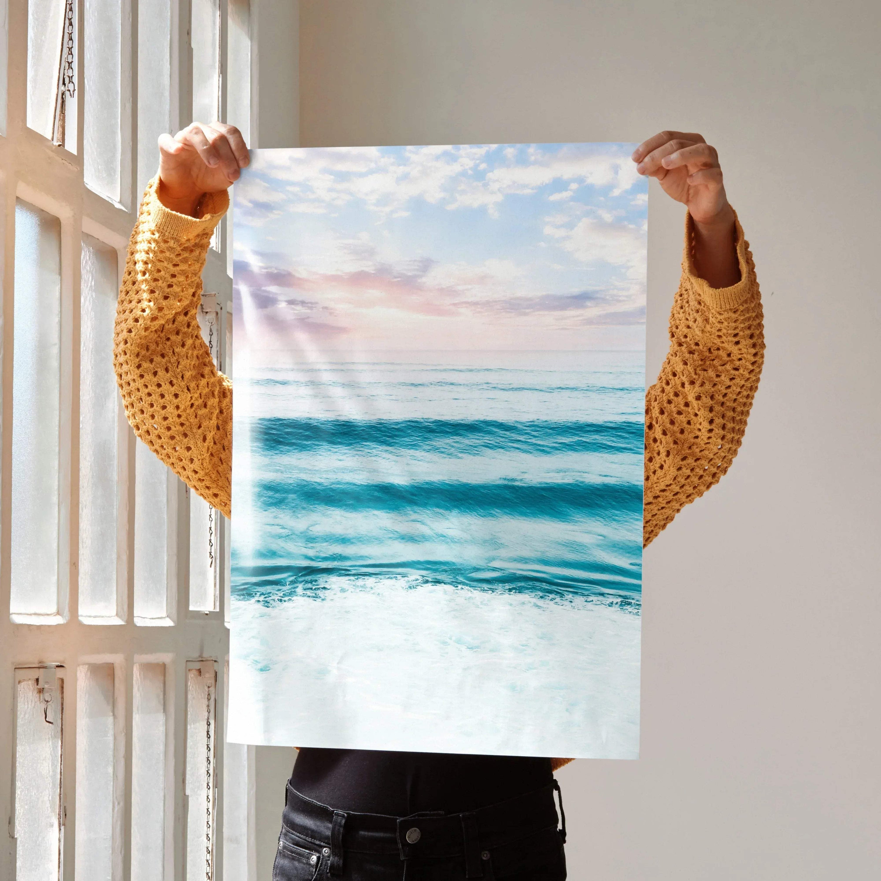 Ocean sunset with soft pink and blue sky over calm waves poster wall art.
