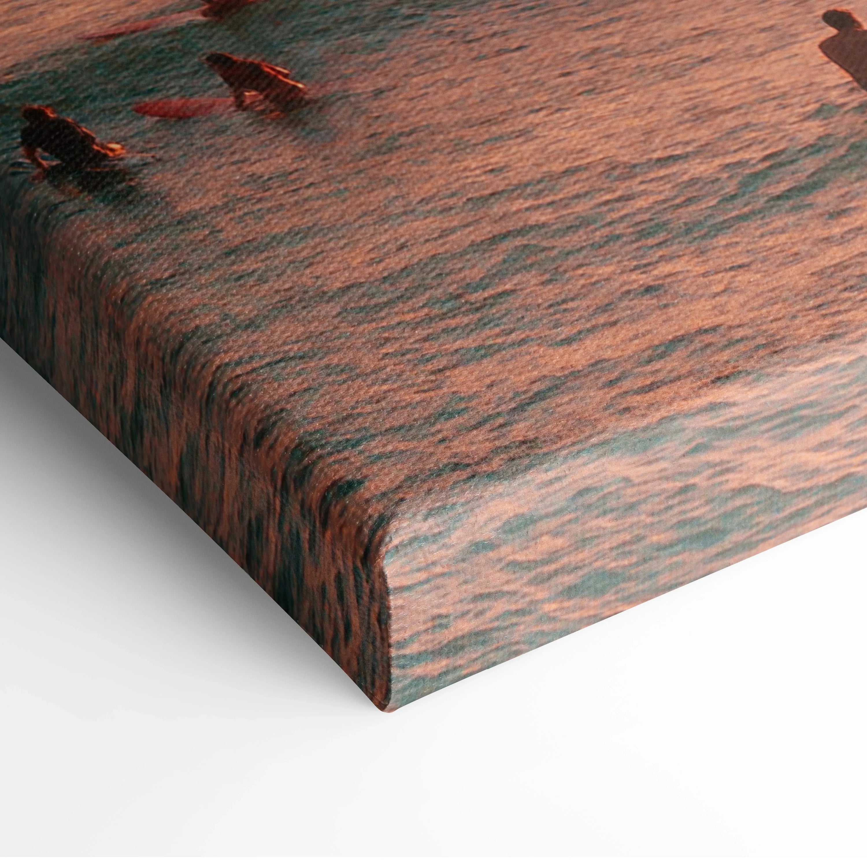 Canvas wall art featuring a golden sunset over ocean waves with warm orange reflections.