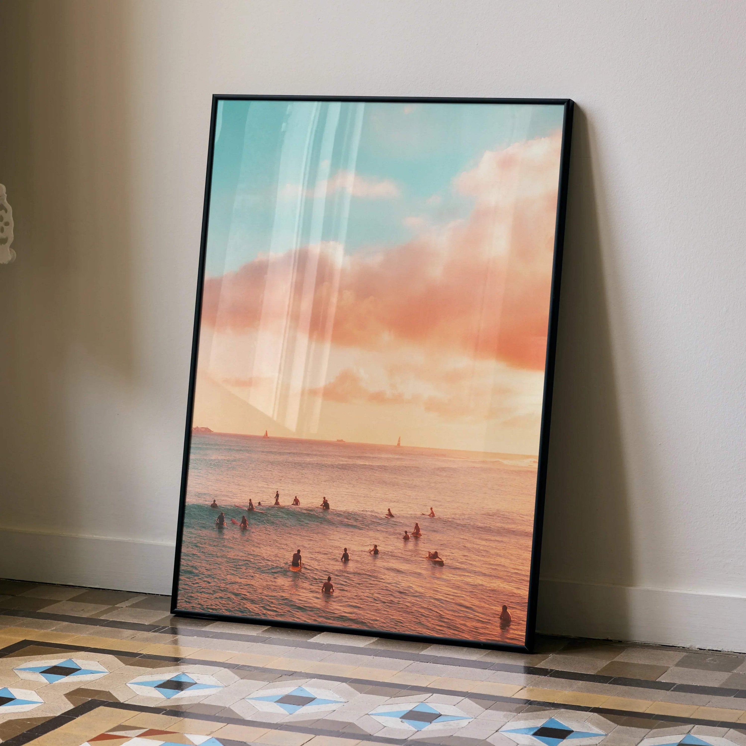Vertical ocean sunset poster with soft pink and blue skies and silhouetted swimmers wall art.